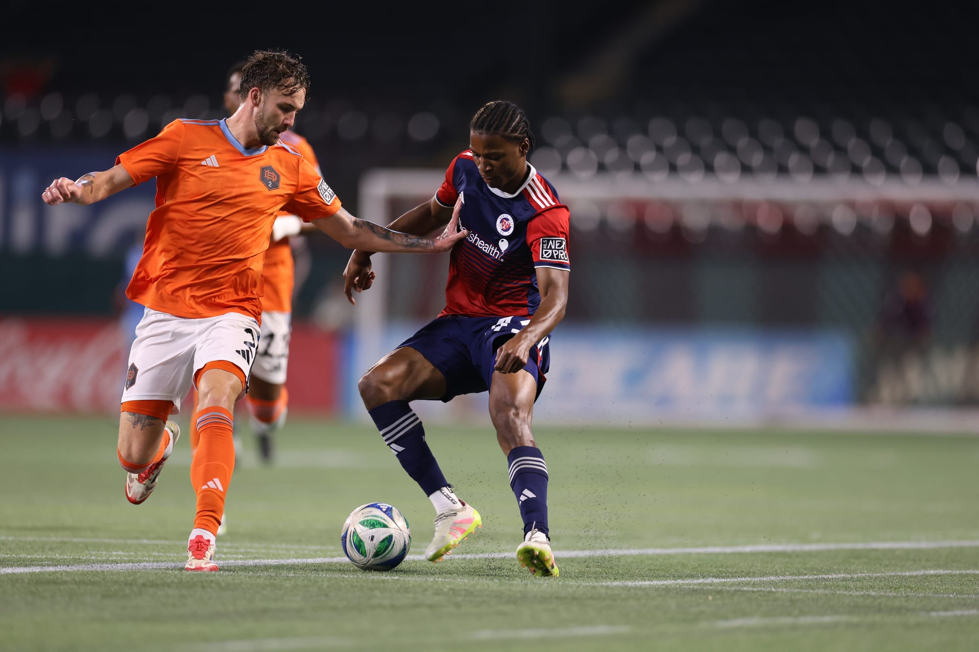 Tarik Scott (right) battles for the ball against Houston Dynamo 2. (Photo via North Texas SC)