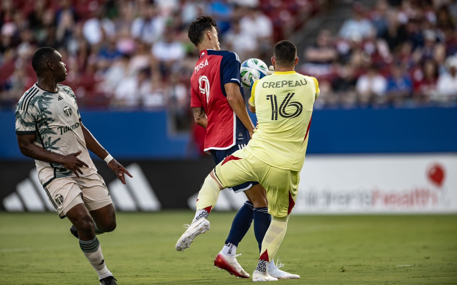 Petar Musa bumps into Maxim Crepeau to help score FC Dallas’ first goal. (Photo via Mike Brooks)
