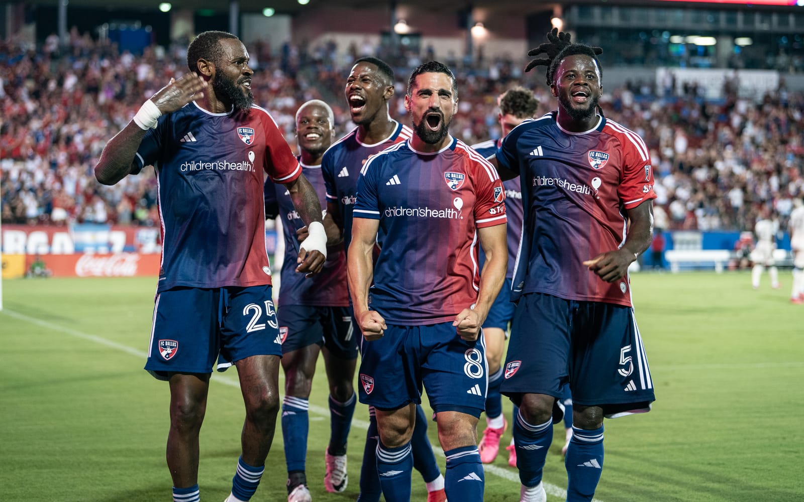 FC Dallas celebrates its second goal against Portland. (Photo via Mike Brooks)