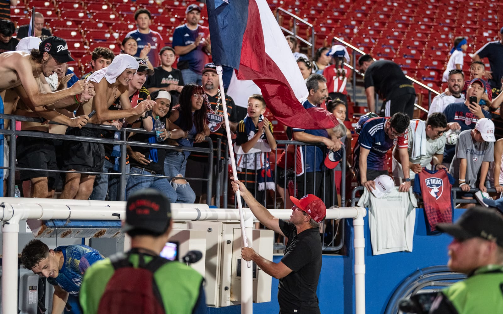 FC Dallas manager Eric Quill celebrates with fans. (Photo via Mike Brooks)